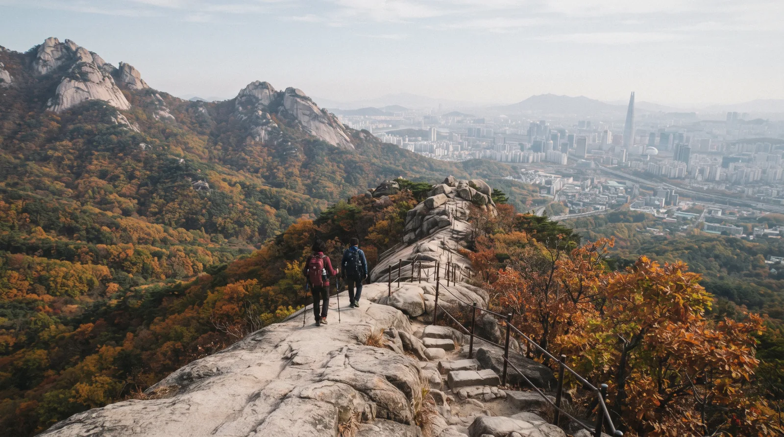 Granite peaks and hikers on a ridge trail in Bukhansan National Park above Seoul, South Korea