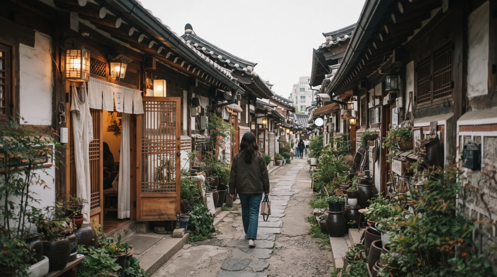 A narrow alley of converted hanok cafes with low tiled eaves in Ikseon-dong, Seoul, South Korea