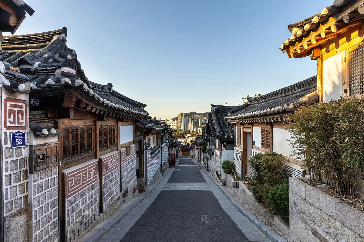 Hanok roofs along Bukchon-ro 11-gil at sunrise in Bukchon Hanok Village, Seoul, South Korea